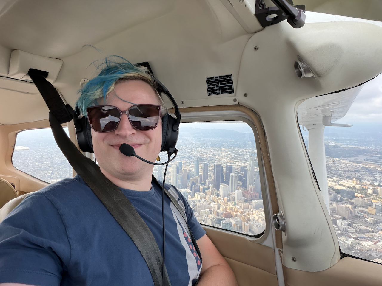 Sam in the cockpit of a Cessna 172 flying over downtown Los Angeles